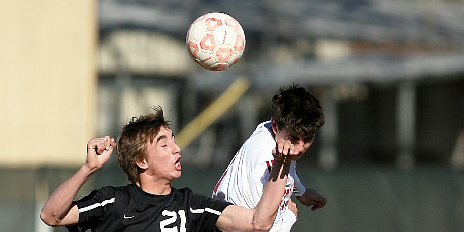Football player headering the ball