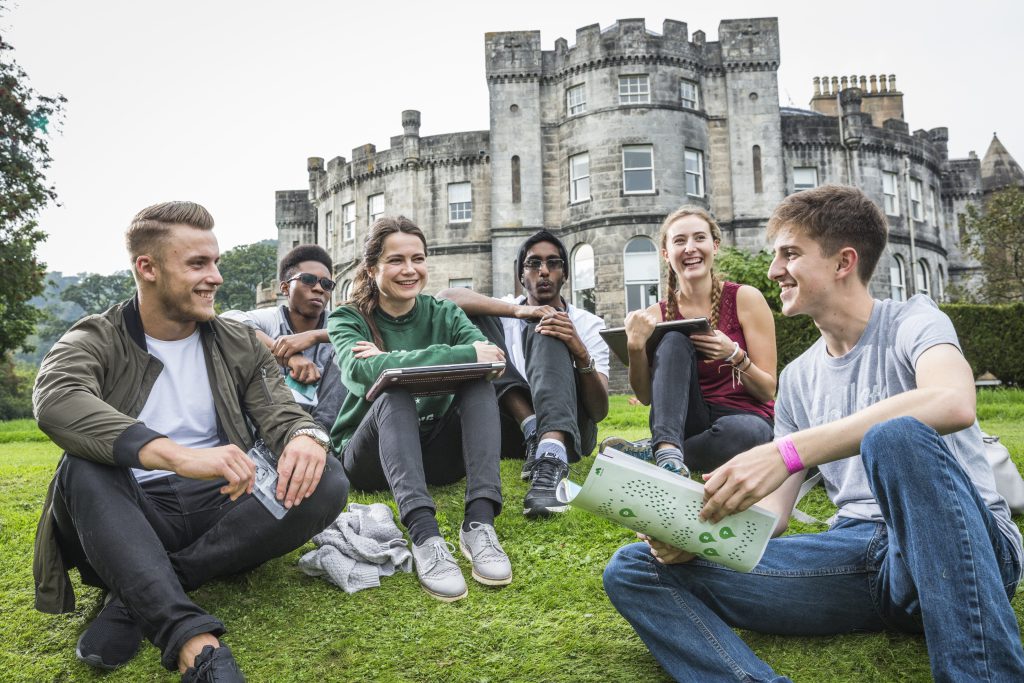 Stirling students sitting outside Airthrey Castle