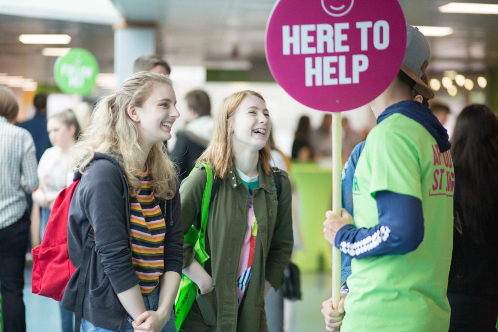 Two people talking to a student ambassador at the University of Stirling's Open Day