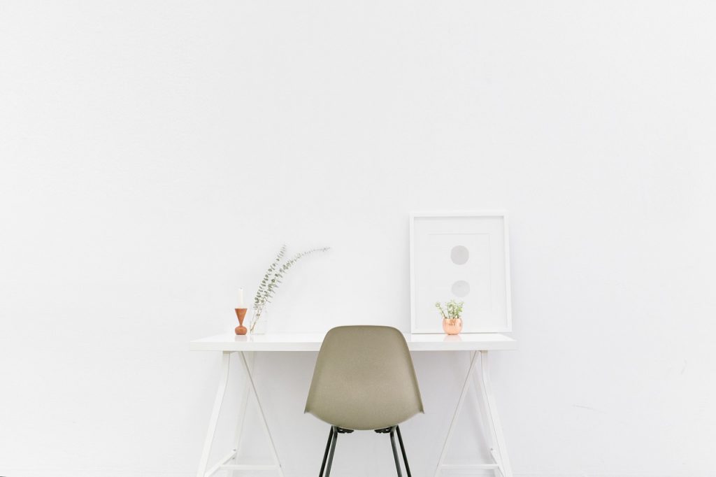 A minimalist desk set against a sheer white backdrop.
