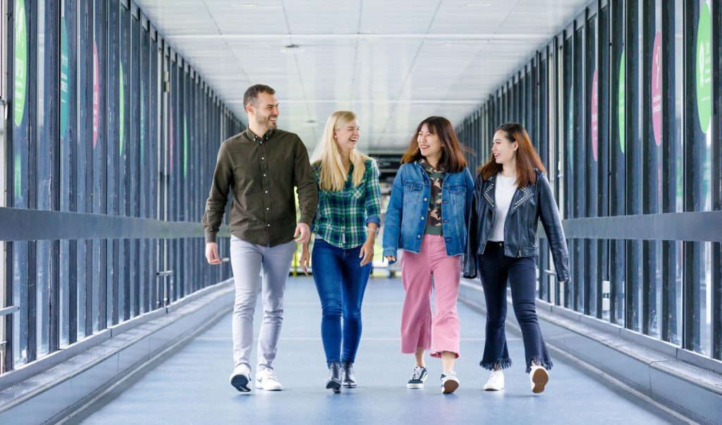 Link bridge with four students walking on a normal day 