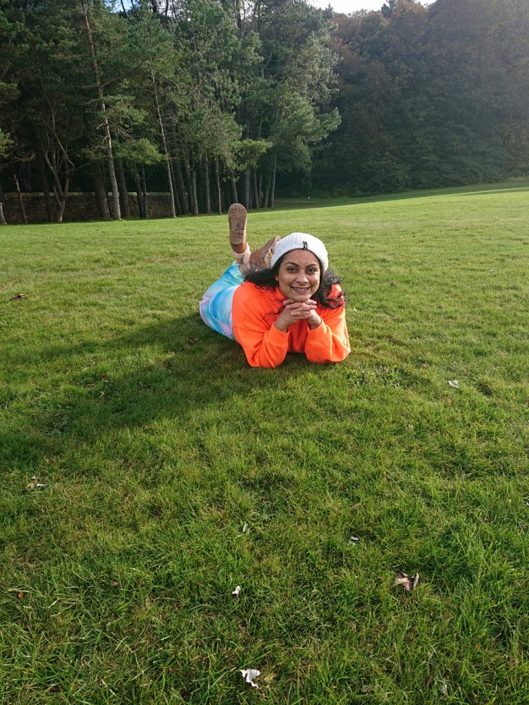 Priya Rawal lying on grass